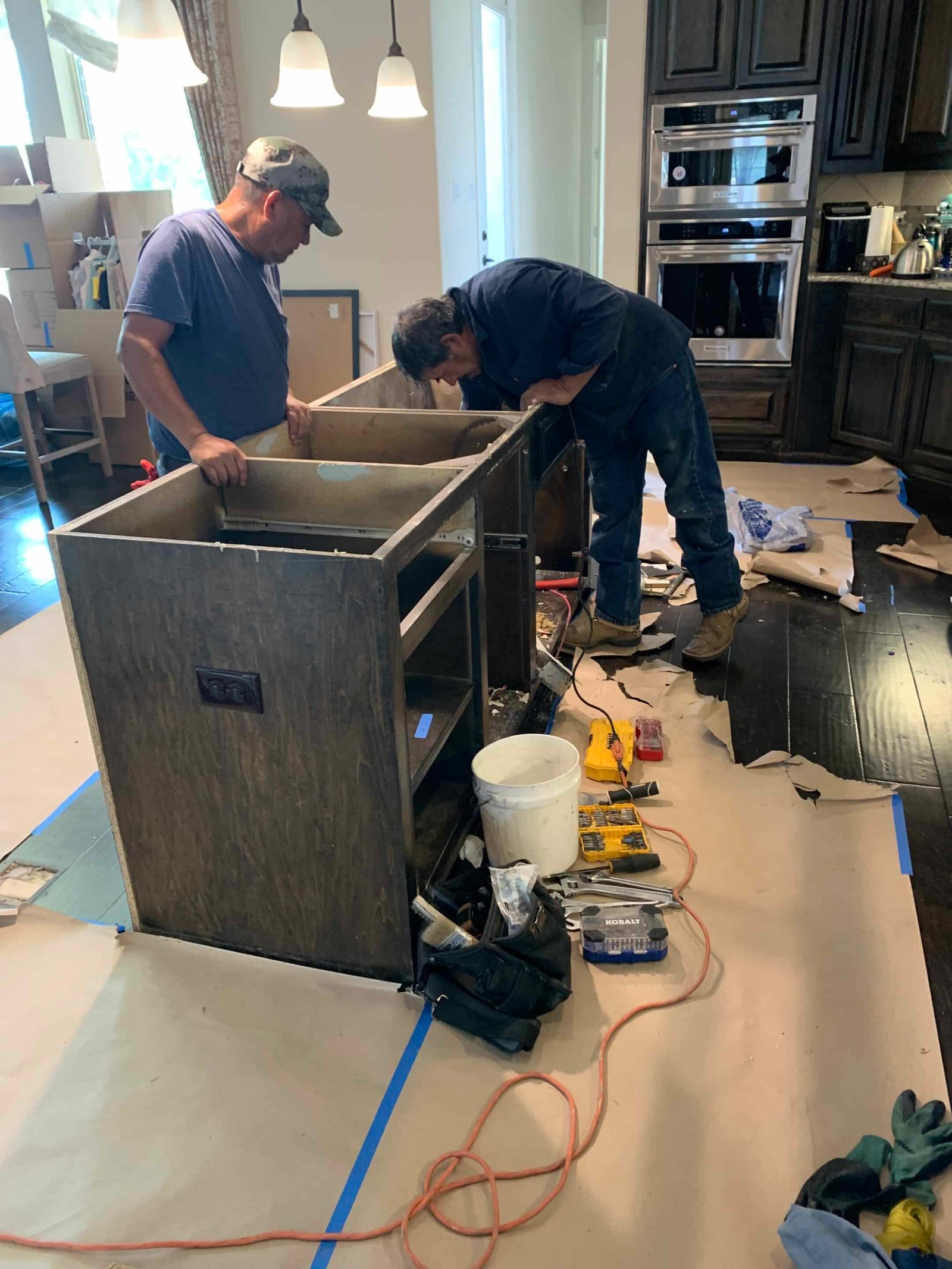 Restoration technicians performing reconstruction work inside a Dallas home