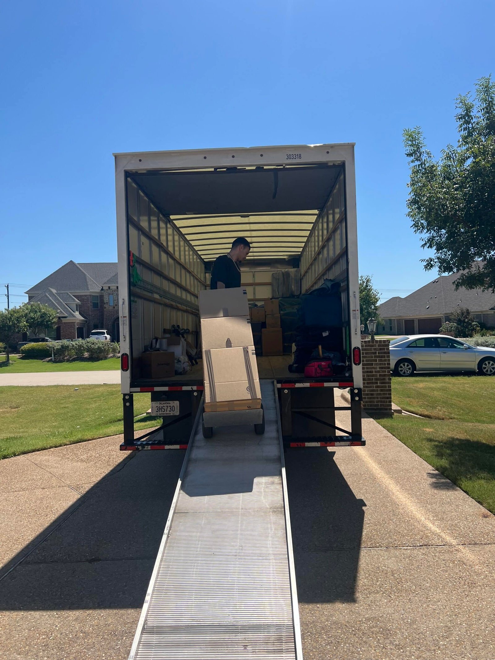 Restoration technician loading belongings during a content pack-out service in Dallas