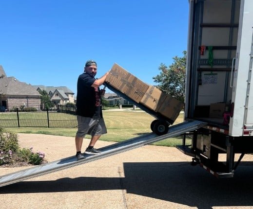 Rush Dry Restoration team member handling contents during a restoration project in Richardson, Texas