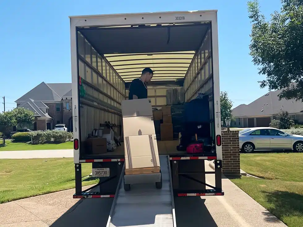Content Pack-Out Dallas Fort Worth - worker loading box into Rush Dry Restoration truck