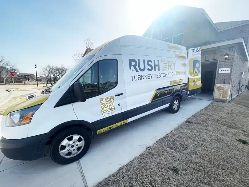 Rush Dry Restoration service van parked outside a Frisco, TX property, representing reliable water damage restoration services